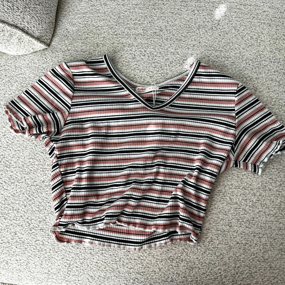 Cute white, black and pink crop top with ruffles on the bottom! V-neck.